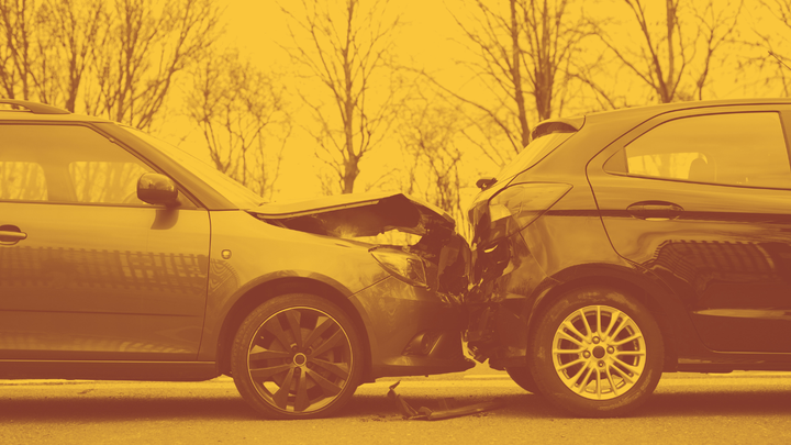 a photo of two cars in a minor accident - one rear-ending the other.